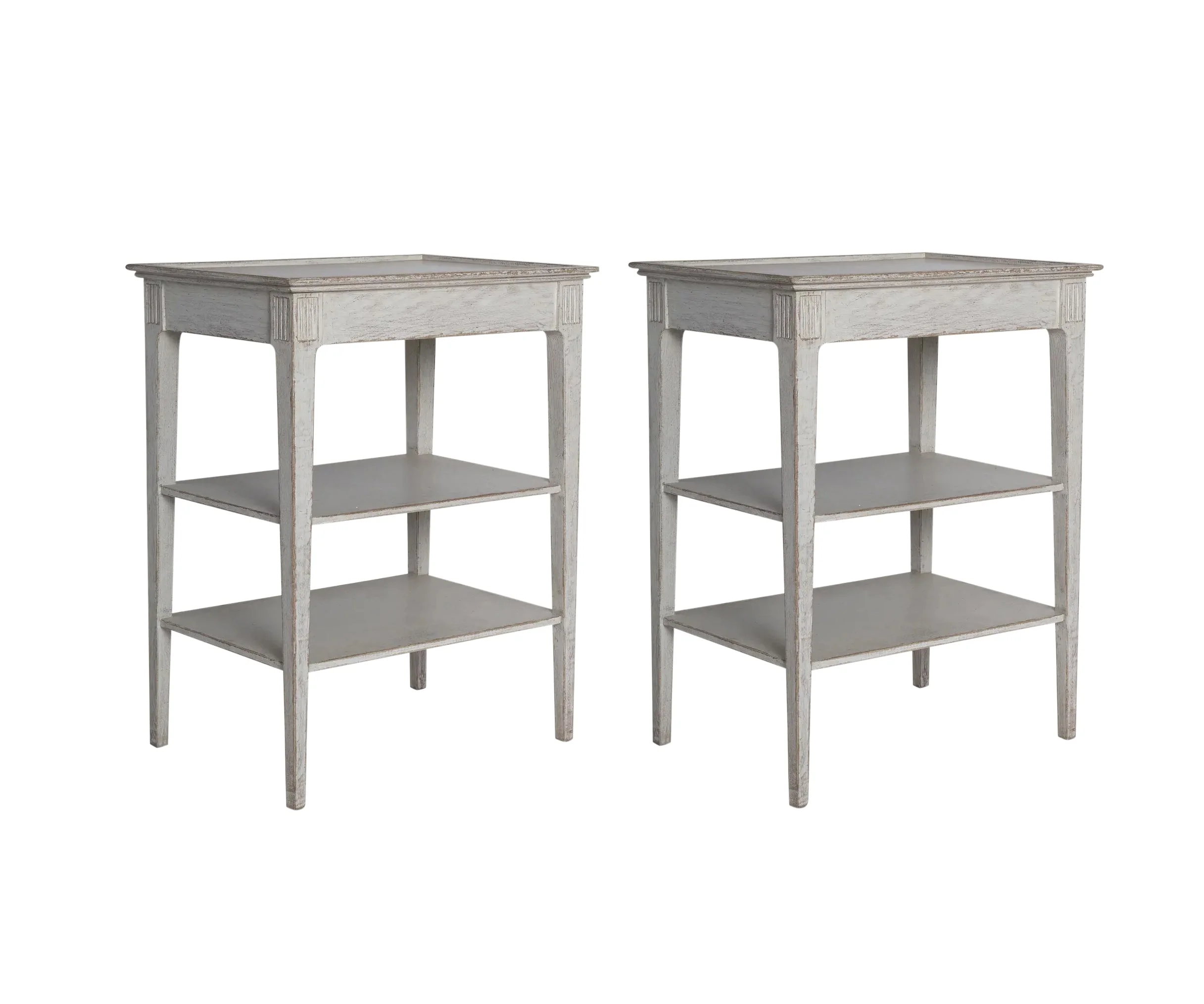 A Pair of Three Tier Side Tables in an Antique White Finish